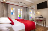 Two adjacent twin bedrooms