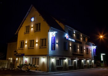 Hotel Front - Evening/Night