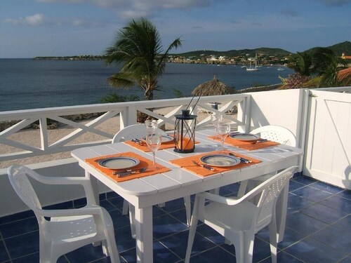 Dive into paradise at our oceanfront townhome -- sea & pool just steps away!
