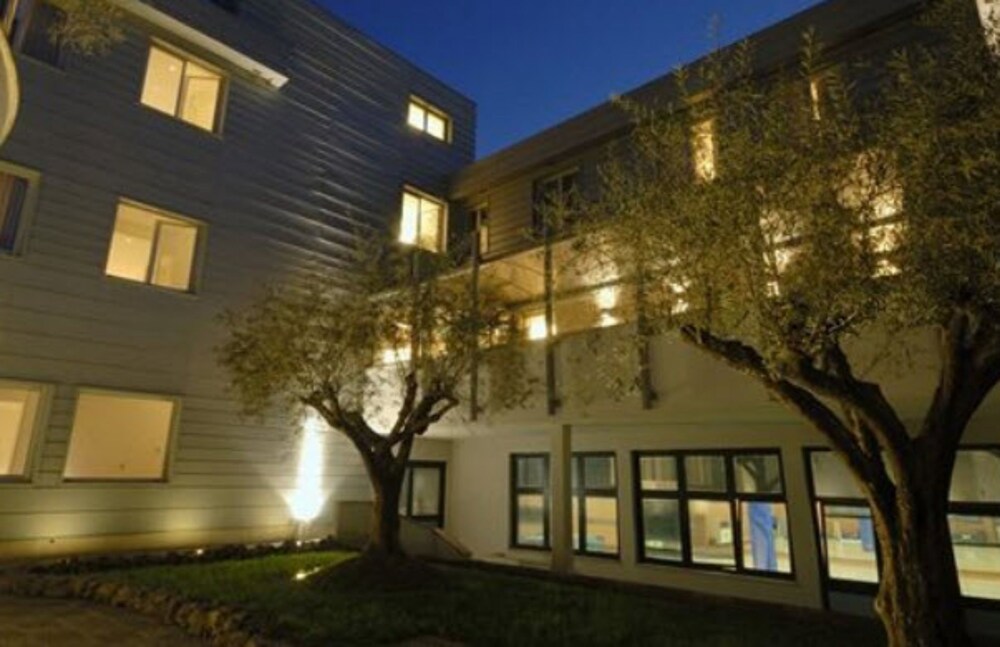 Hotel Front - Evening/Night