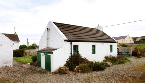 OPEN . Traditional, petite charming Irish country cottage.