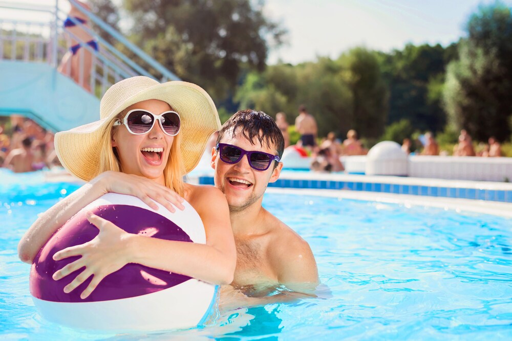 Teen couple having public pool