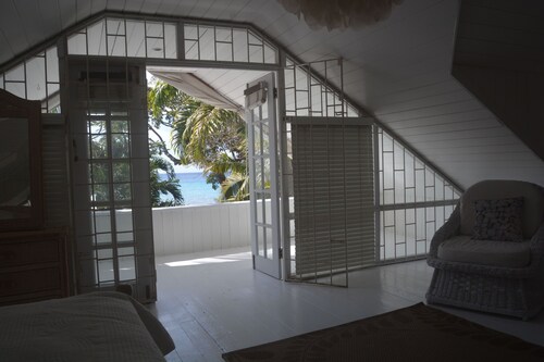 A Caribbean Style seaside home only steps from the beautiful Fitts Village Beach