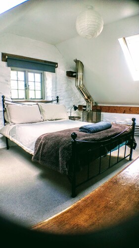 A spacious yet cosy eco converted dairy barn, situated within a vineyard.