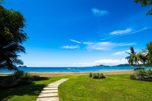 DIRECTLY ON THE BEACH-Luxury Immaculate Condo w/amazing ocean views/surf sounds!