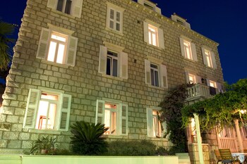 Hotel Front - Evening/Night