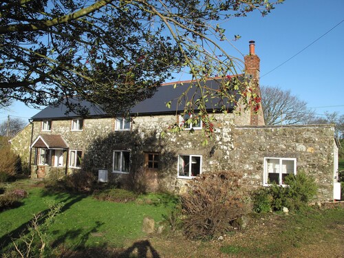 Cottage Set In Rolling Countryside