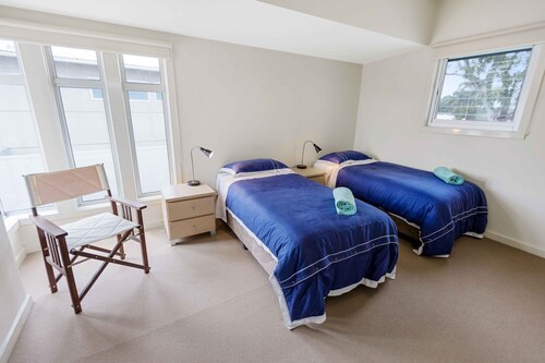 Stunning light-filled holiday home with private beach and jetty on the canals