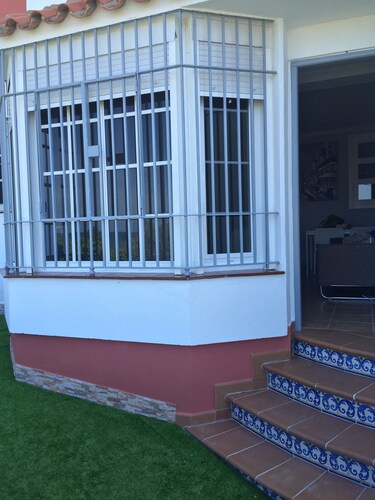 APARTMENT WITH IMPRESSIVE VIEWS TO THE BEACH WITH PATIO Roofing.