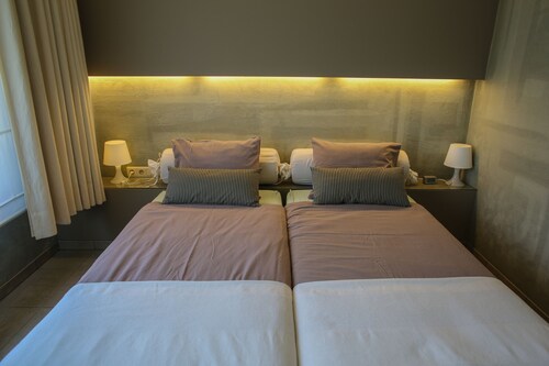 Luxury designer apartment, near the sea with private garden and parking