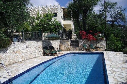 Beautiful Villa, short walk to Agni Beach, heated pool with stunning views