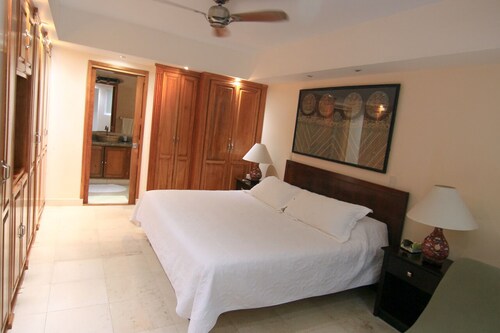Beautiful beachfront condo with heated pool and white sand beach.