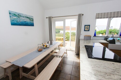 Great south facing valley views, nearby coastal path and stunning surfing beach.