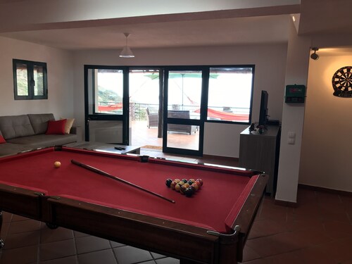 Villa with infinity pool and games room overlooking the sea
