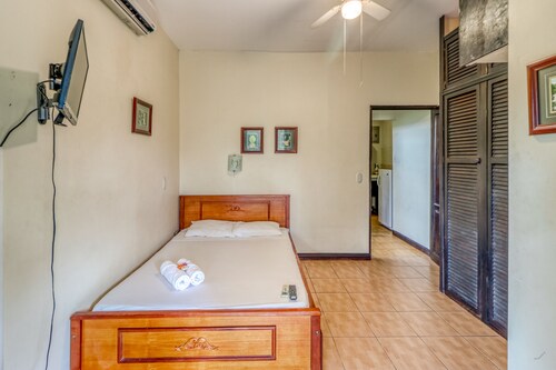 Comfortable room w/great location, A/C, and shared outdoor pool!