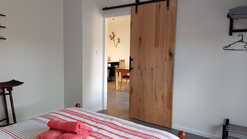 Red Ochre – Large 1BR with Private Courtyard