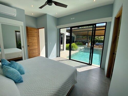 Executive tropical home steps from the beach!