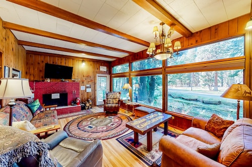 Charming Wallowa Lake home with forest views, fireplace, & private W/D