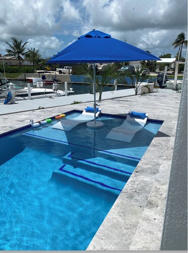Gorgeous new build on Cudjoe Marina Basin with 80 ft boat dock and private pool