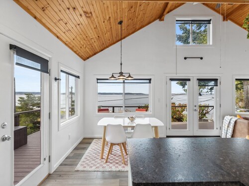 Darling pink beach house with epic views in a cozy community.