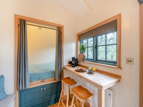 Set among the fruit trees with views of the fields.