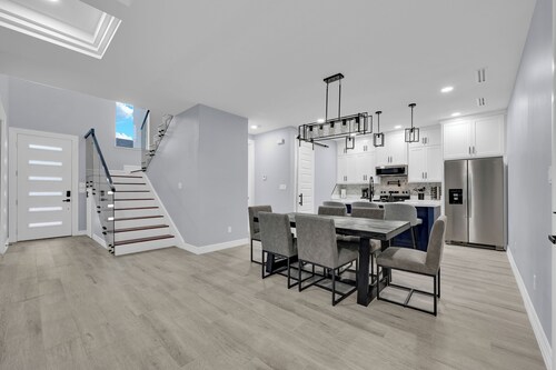 Relax + Unwind in this Modern & Spacious Townhome With 2 Car Garage