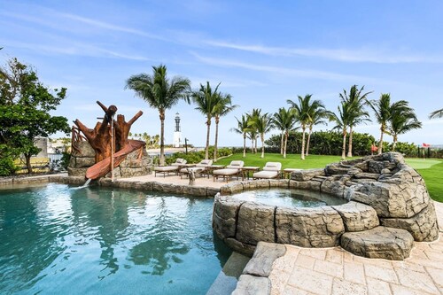 Luxurious 3-story Estate With Gym Pool Slide Private Beach and Lighthouse Views