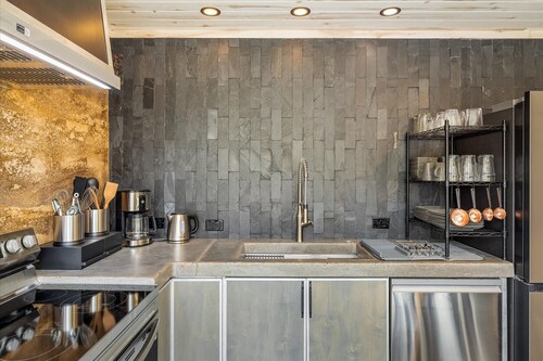 Earth-Built Cabin with Pine Shadows and a Tub That Waits