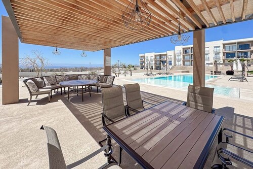 Bright and Modern Condo w/ Balcony, Shared Pool, A/c, Minutes to Beach & Town