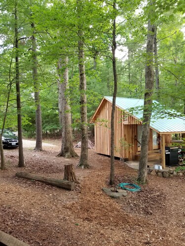 Unique Historical log cabin with private beach and 300 ft. of waterfrontage.