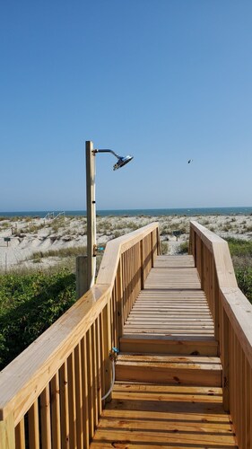 Charming Beachfront Cottage Awaits You! Direct access to beach off deck/walkway.