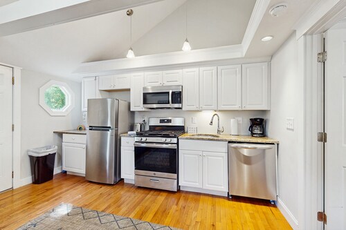 Charming updated bungalow with firepit, WiFi, & dog-friendly, near beach