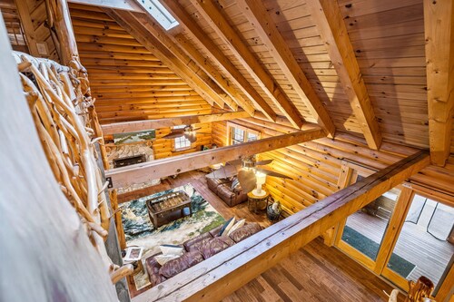 Lakefront Log Cabin w/ Beach, Hot Tub, & Fire Pit