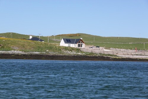 Shore Cottage -The sea and the sky become one in this gem of a cottage.