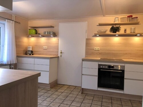 Ferienhaus "Großes Reetdachhaus Langenhorn" mit Garten, Terrasse und WLAN