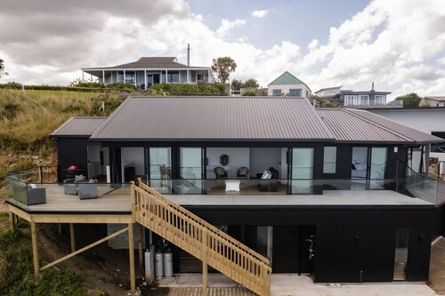 Sunset Delight. Beautiful home with expansive sea views.
