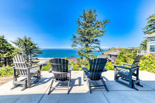 Amazing ocean-view escape with seven bedrooms, scenic patios, & modern interior