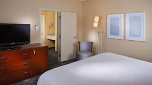 Premium bedding, desk, laptop workspace, iron/ironing board
