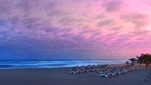 Beach nearby, white sand, sun loungers, beach umbrellas
