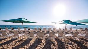 Private beach, beach umbrellas