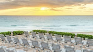 On the beach, white sand, beach cabanas, beach massages