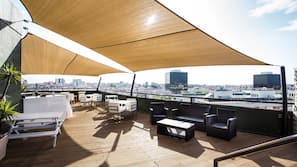 Seasonal outdoor pool, open 9:00 AM to 9:00 PM, pool loungers