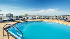 Seasonal outdoor pool, open 9:00 AM to 9:00 PM, pool loungers