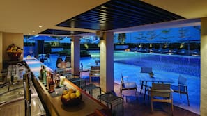 Outdoor pool, open 6:00 AM to 10:00 PM, pool loungers