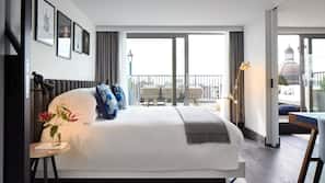 Luxe beddengoed, een minibar, een kluis op de kamer, een bureau