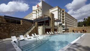Outdoor pool, open 7 AM to 9 PM, pool umbrellas, pool loungers