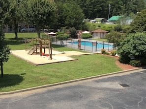 Seasonal outdoor pool, open 9:00 AM to 9:00 PM, pool umbrellas