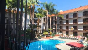 Outdoor pool, open 7:00 AM to 10:00 PM, sun loungers