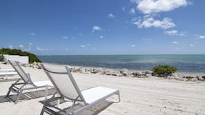 Private beach, white sand, sun loungers, beach towels