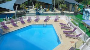 Seasonal outdoor pool, open 3:00 PM to 7:00 PM, free pool cabanas